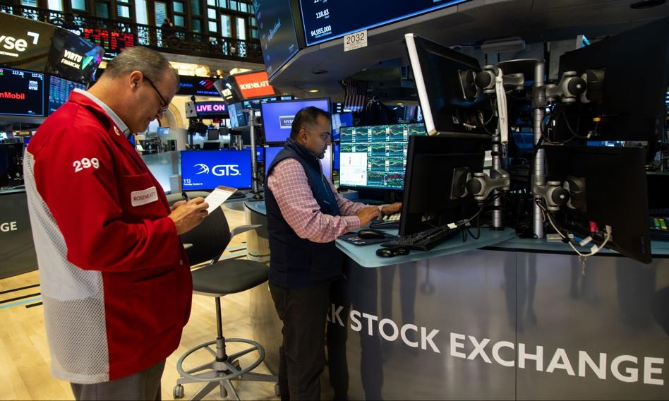 The S&P 500 and Nasdaq hit new records as the market rides a wave of lower interest rates.