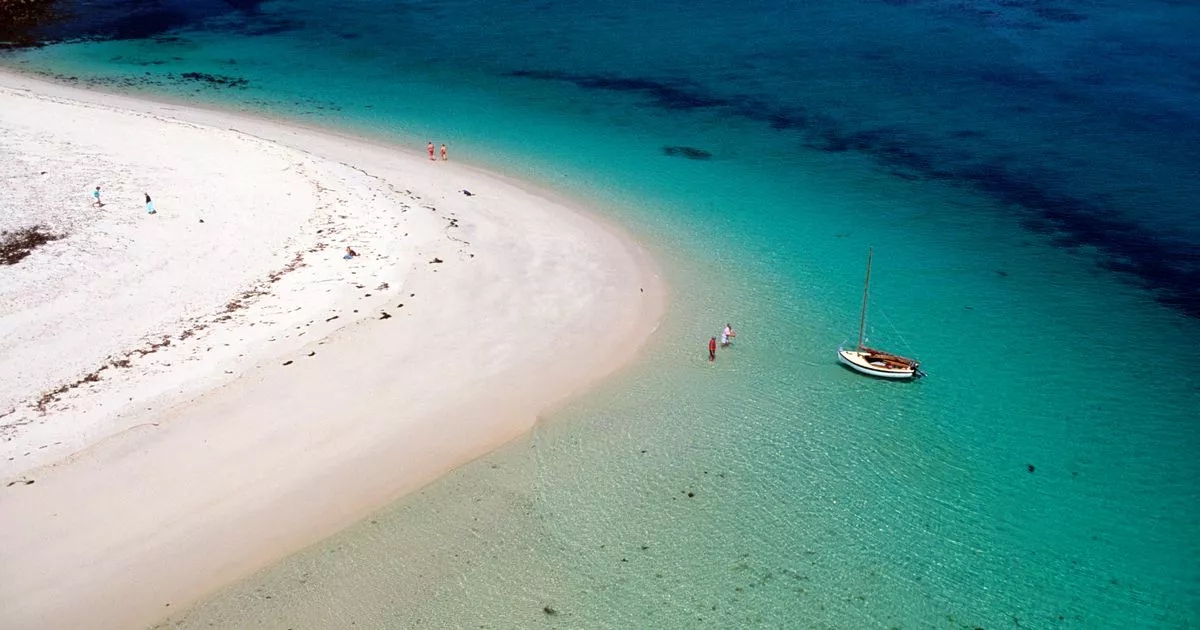 Abandoned UK island with clear water and Caribbean-like beach you can swim to