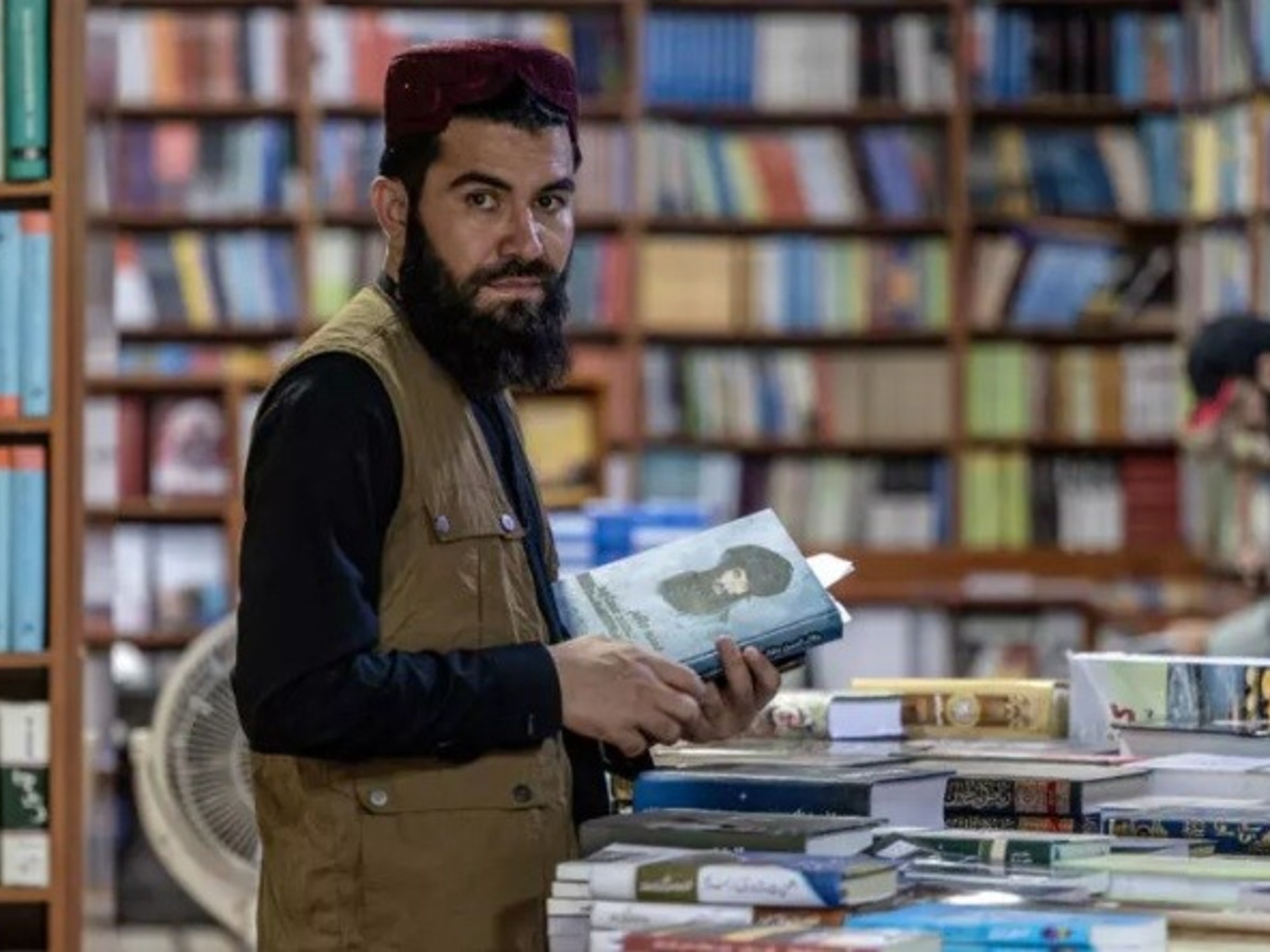 The Taliban trade weapons for pens to express their version of the war.