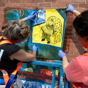 ‘Meant to only last the summer’: Amherst artist’s wheatpaste murals among those now decorating Montague